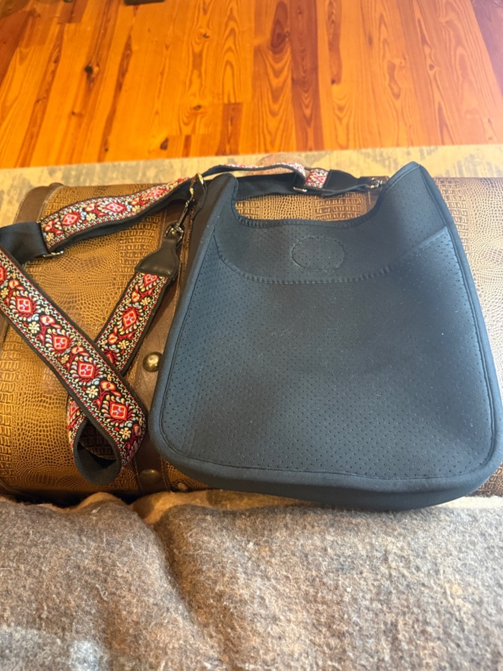 Classic Perforated Crossbody Bag in Black with Patterned Strap and extra strap.